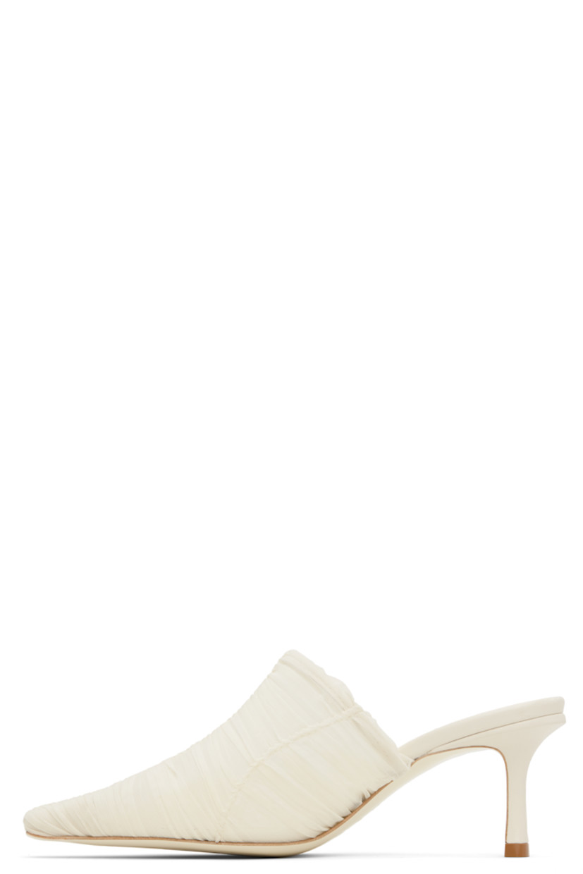 Semi-sheer ruched tulle mules in off-white.

· Pointed square toe
· Covered heel with rubber injection
· Leather sole
· Heel: H2.5"

Supplier color: Ivory