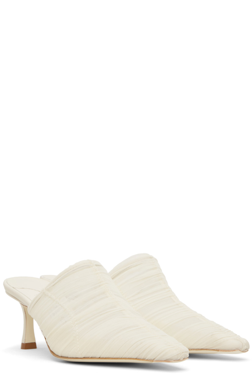 Semi-sheer ruched tulle mules in off-white.

· Pointed square toe
· Covered heel with rubber injection
· Leather sole
· Heel: H2.5"

Supplier color: Ivory