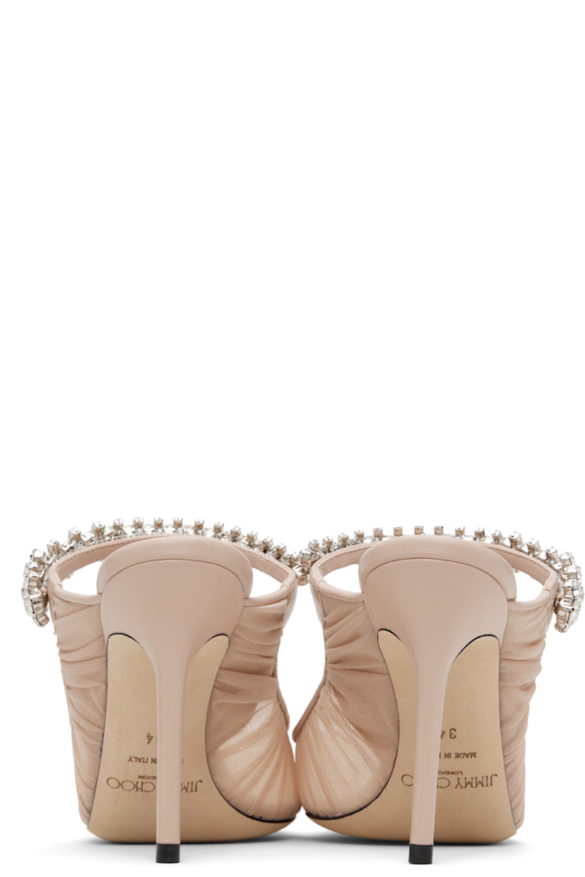 Sheer tulle mules.

· Ruching throughout
· Pointed toe
· Crystal-cut accents at fixed strap
· Logo patch at grained leather footbed
· Leather-covered stiletto heel
· Nubuck sole
· Heel: H4"

Available exclusively at SSENSE.

Supplier color: Macaron