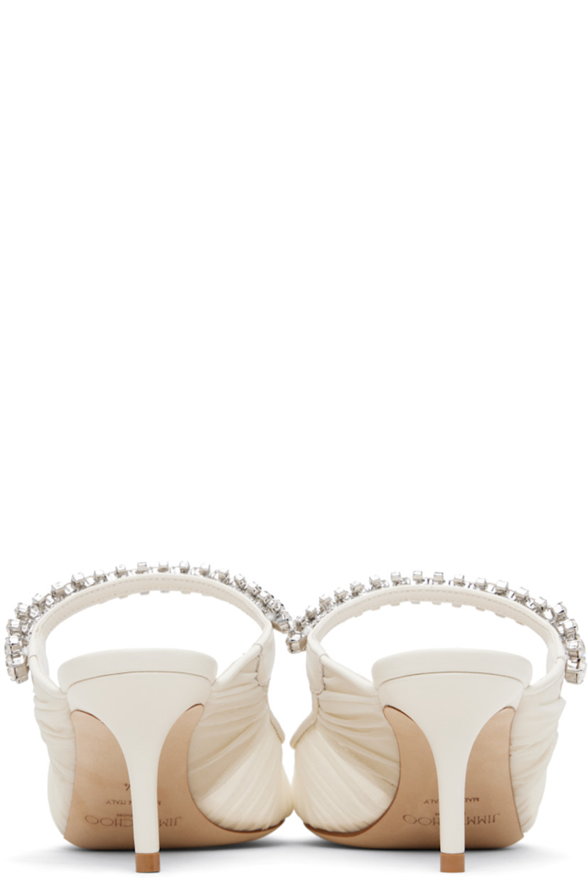 Sheer tulle mules.

· Ruching throughout
· Pointed toe
· Crystal-cut accents at fixed strap
· Logo patch at grained leather footbed
· Leather-covered stiletto heel
· Nubuck sole
· Heel: H2.5"

Available exclusively at SSENSE.

Supplier color: Ivory