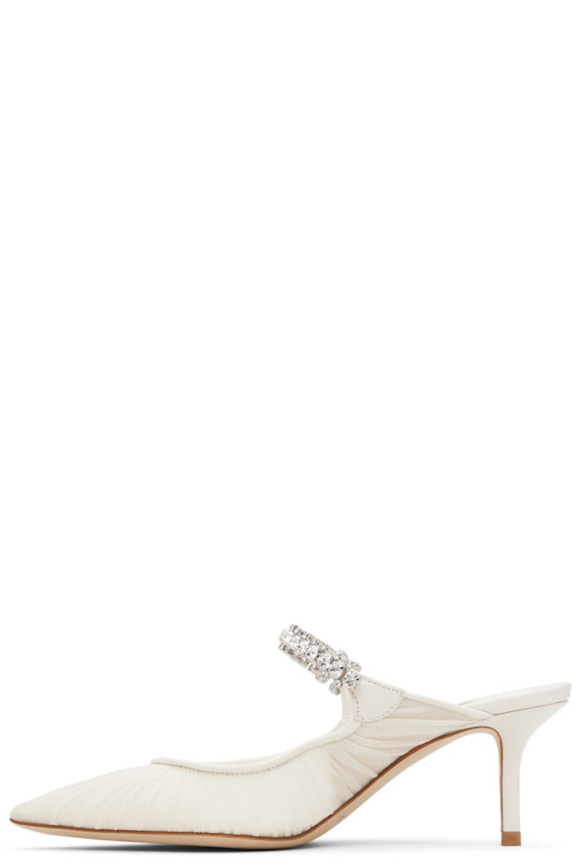 Sheer tulle mules.

· Ruching throughout
· Pointed toe
· Crystal-cut accents at fixed strap
· Logo patch at grained leather footbed
· Leather-covered stiletto heel
· Nubuck sole
· Heel: H2.5"

Available exclusively at SSENSE.

Supplier color: Ivory