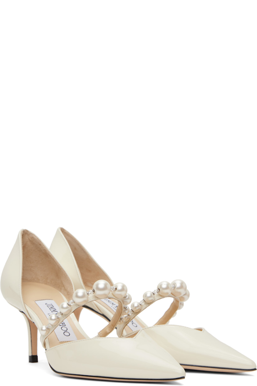 LWG-certified patent leather heels in off-white.

· Pointed toe
· Faux-pearl and beaded accents at vamp
· Partially elasticized strap 
· Logo patch at padded leather footbed
· Covered heel with rubber injection
· Nubuck sole
· Heel: H2.25"

Supplier color: Latte