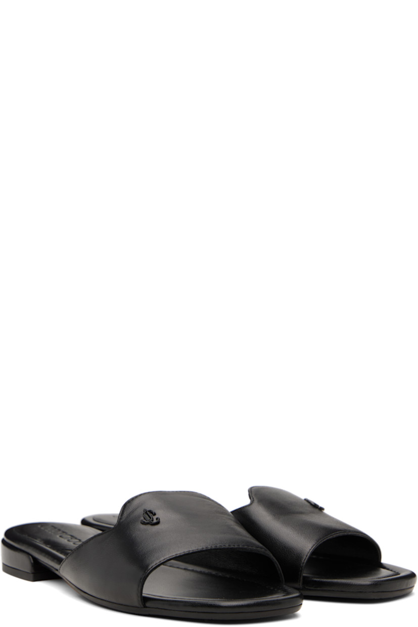 Buffed leather slip-on sandals in black. 

· Open square toe
· Strap with logo hardware at vamp
· Logo embossed at molded footbed 
· Covered block heel with rubber injection
· Nubuck and treaded rubber sole

Supplier color: Black