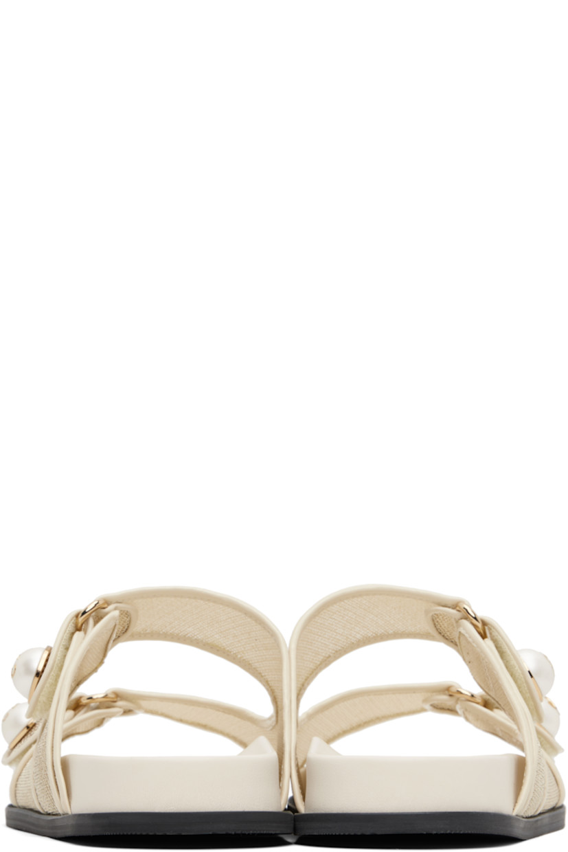 Semi-sheer mesh and buffed leather slip-on sandals in off-white and gold tone.

· Open toe
· Faux-pearl with logo hardware at velcro straps
· Treaded rubber sole

Supplier color: Champagne/Latte