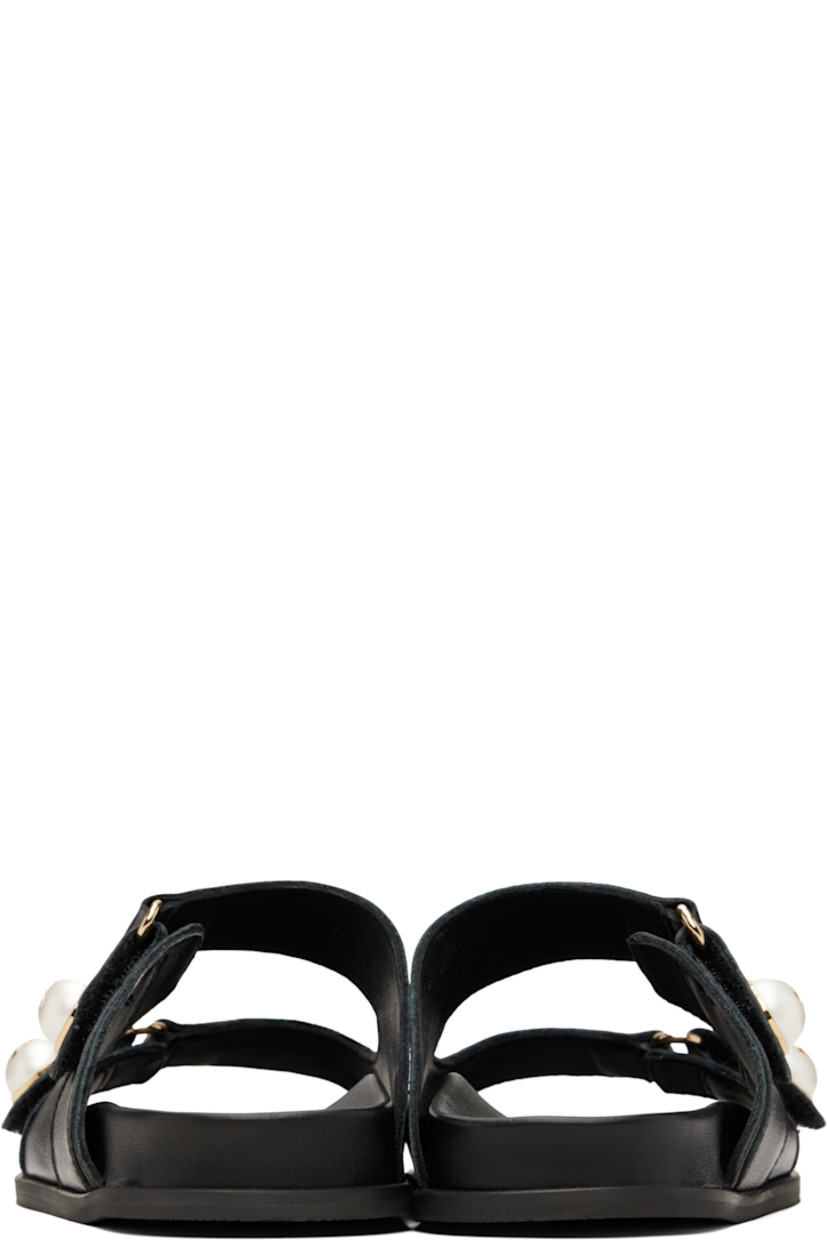 Buffed leather slip-on flat sandals in black.

· Open toe
· Faux-pearl and logo hardware at velcro straps
· Logo embossed at molded leather footbed
· Treaded rubber sole

Supplier color: Black