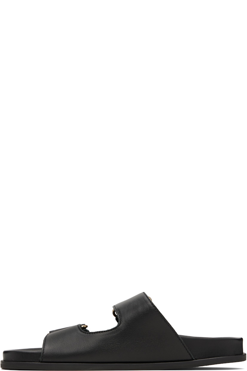 Buffed leather slip-on flat sandals in black.

· Open toe
· Faux-pearl and logo hardware at velcro straps
· Logo embossed at molded leather footbed
· Treaded rubber sole

Supplier color: Black