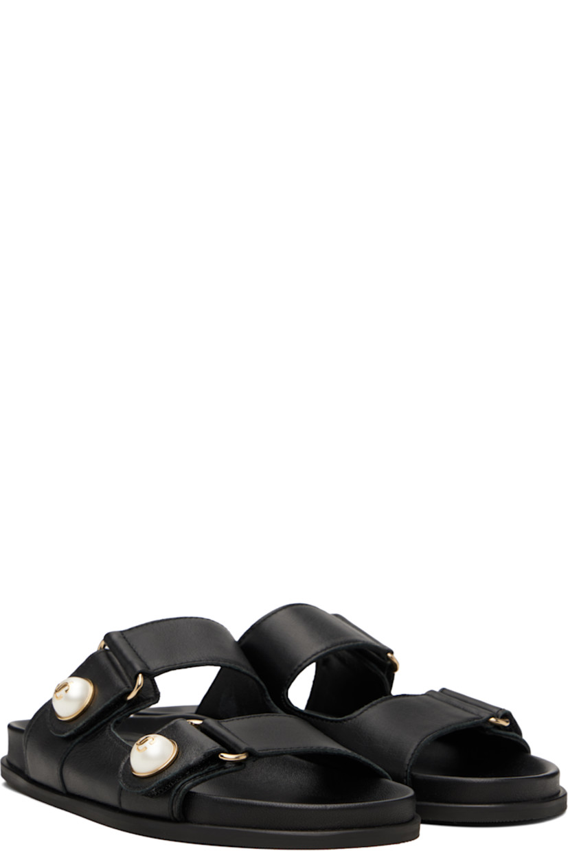 Buffed leather slip-on flat sandals in black.

· Open toe
· Faux-pearl and logo hardware at velcro straps
· Logo embossed at molded leather footbed
· Treaded rubber sole

Supplier color: Black