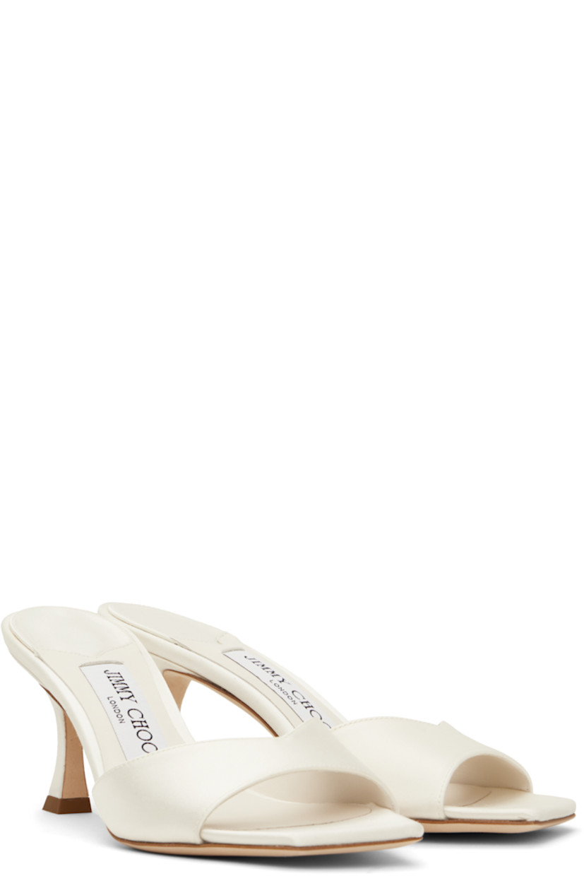 Satin heeled sandals in off-white.

· Open square toe
· Strap at vamp
· Logo patch at buffed leather footbed
· Covered spool heel with rubber injection
· Suede sole
· Heel: H2.75"

Supplier color: Ivory