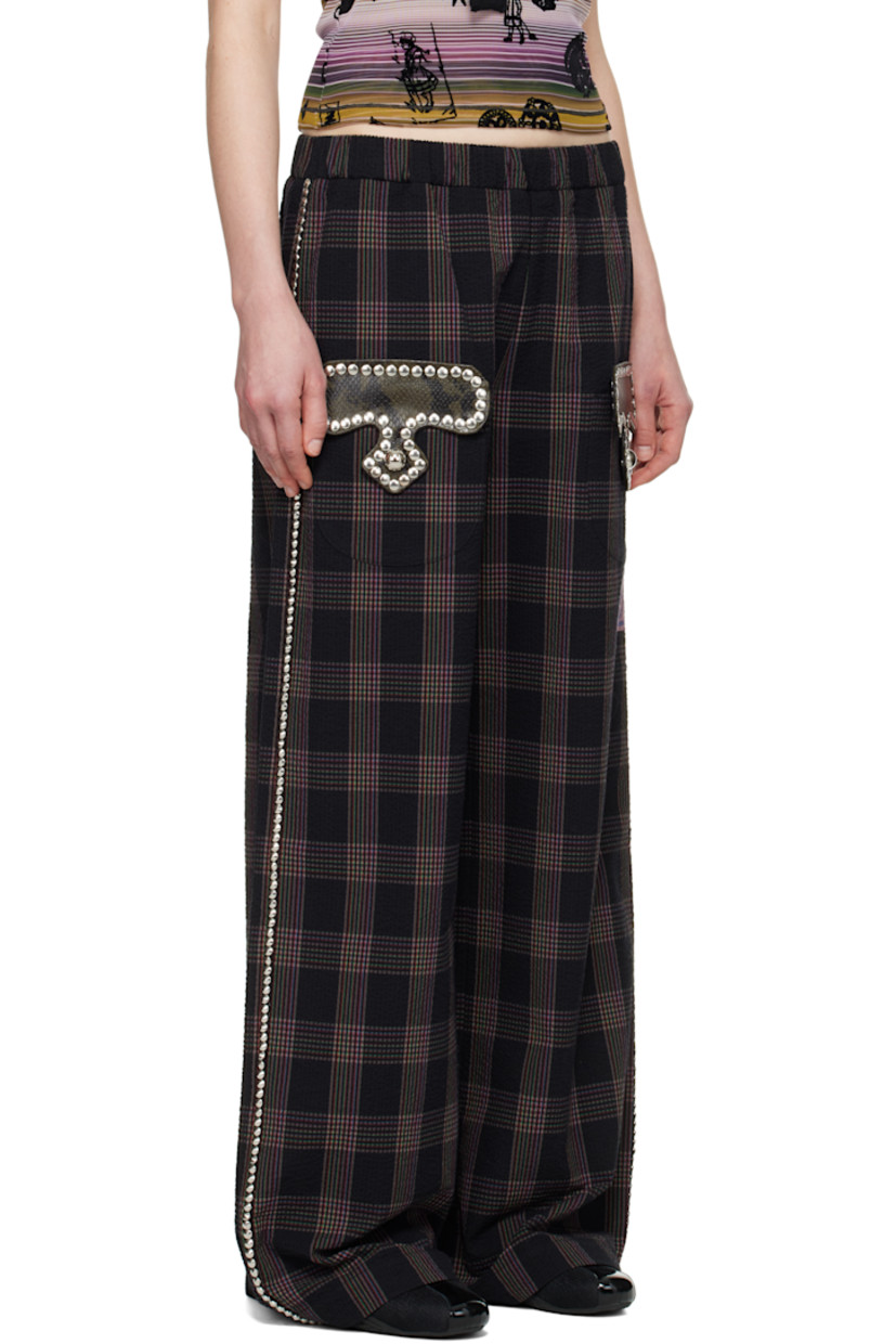 Cotton seersucker trousers. Check pattern printed throughout. 

· Elasticized waistband
· Two-pocket styling
· Snake-embossed leather trim and studs at pockets
· Embroidered logo patch at leg
· Studded trim at outseams

Supplier color: Rainbow tartan