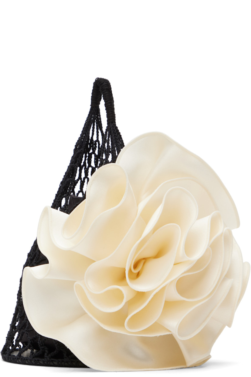 Crocheted cotton-blend pouch in black.

· Carry handle
· Detachable floral silk appliqué at face
· Calfskin base
· Removable satin drawstring pouch at interior
· H6.5" x W5.5" x D5.5"

Supplier color: Black