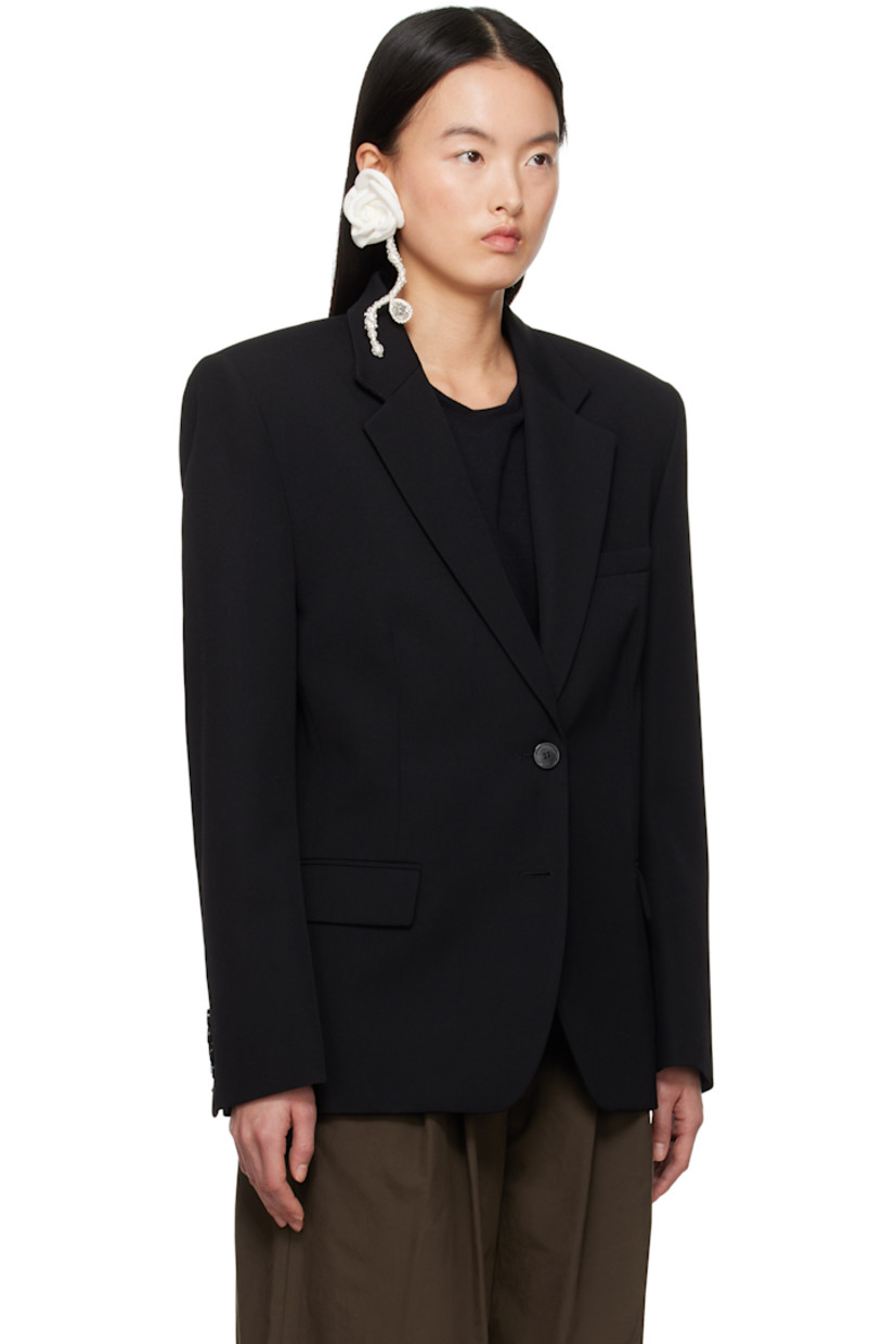 Wool twill blazer. 

· Notched lapel
· Two-button closure
· Welt pocket and flap pockets
· Padded shoulders
· Four-button surgeon's cuffs 
· Twin vents at back hem
· Welt pockets at interior
· Full silk damask lining
· Horn hardware

Supplier color: Black