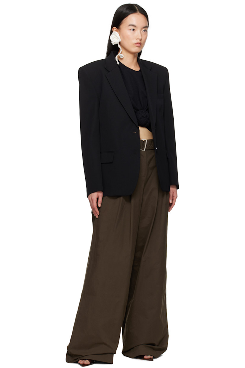 Wool twill blazer. 

· Notched lapel
· Two-button closure
· Welt pocket and flap pockets
· Padded shoulders
· Four-button surgeon's cuffs 
· Twin vents at back hem
· Welt pockets at interior
· Full silk damask lining
· Horn hardware

Supplier color: Black
