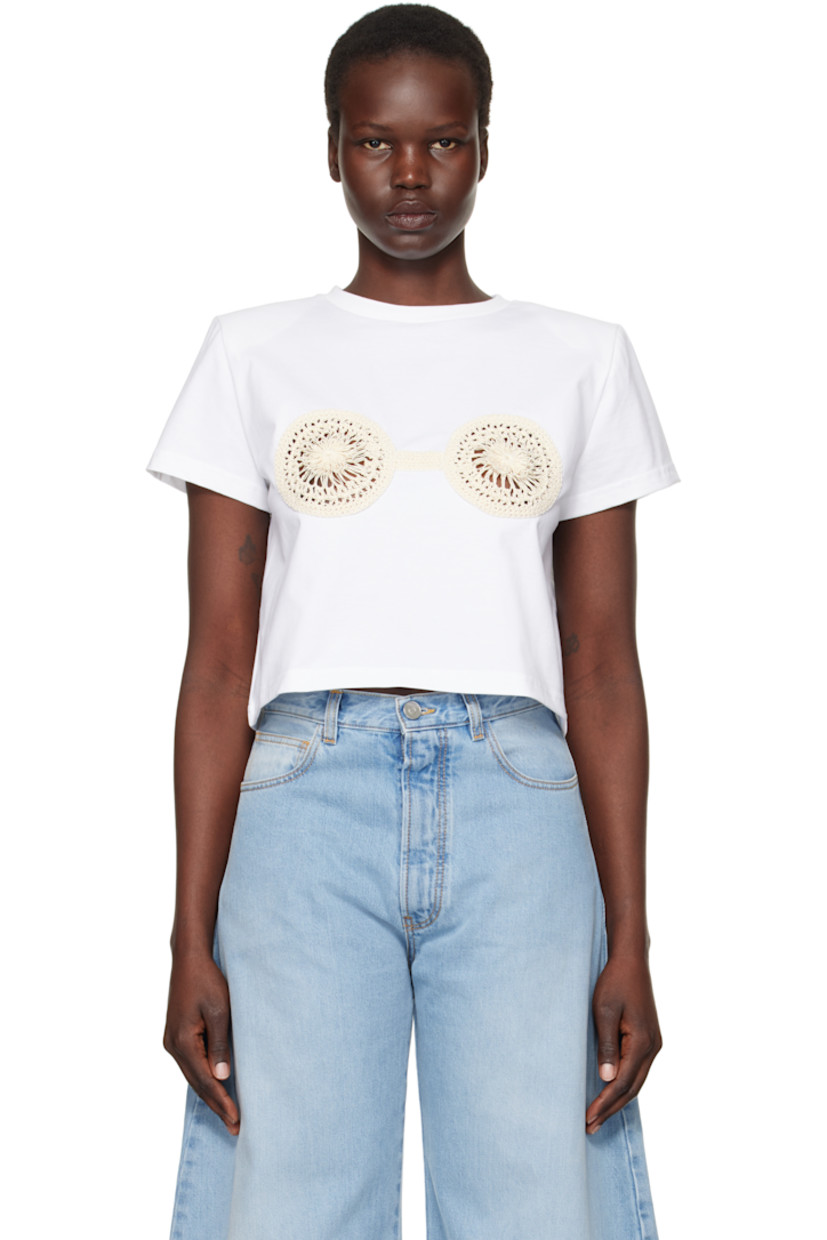 Cotton jersey T-shirt.

· Rib knit crewneck
· Crochet appliqués at chest
· Removable shoulder pads

Supplier color: White