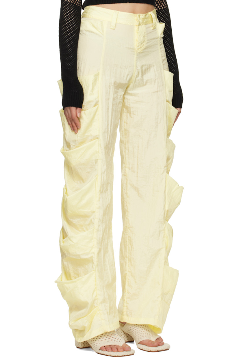 Handcrafted nylon taffeta trousers. 

· Belt loops
· Two-pocket styling
· Button fly
· Draped patch pockets at outseams

Supplier color: Banana