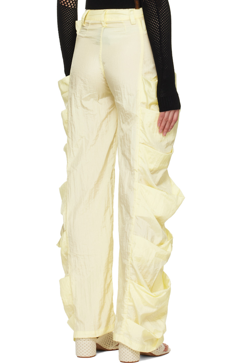 Handcrafted nylon taffeta trousers. 

· Belt loops
· Two-pocket styling
· Button fly
· Draped patch pockets at outseams

Supplier color: Banana