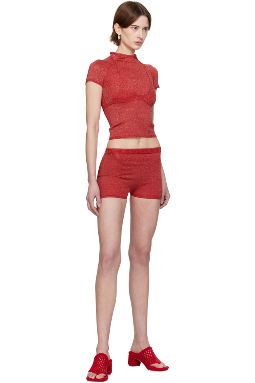 Handcrafted knit stretch rayon bra. Metallic threads throughout.

· V-neck
· Rib-knit hem
· Self-tie halter straps

Handcrafted sheer knit stretch rayon T-shirt. Metallic threads throughout.

· Rib-knit cowl neck, hem, and cuffs
· Cap sleeves
· Logo patch at back hem

Wholesale exclusivity at SSENSE.

Supplier color: Cherry red