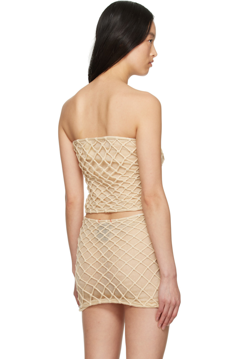 Handcrafted semi-sheer knit and macramé stretch rayon tube top. 

· Can be worn as top or skirt
· Elasticized straight neck

Supplier color: Beige