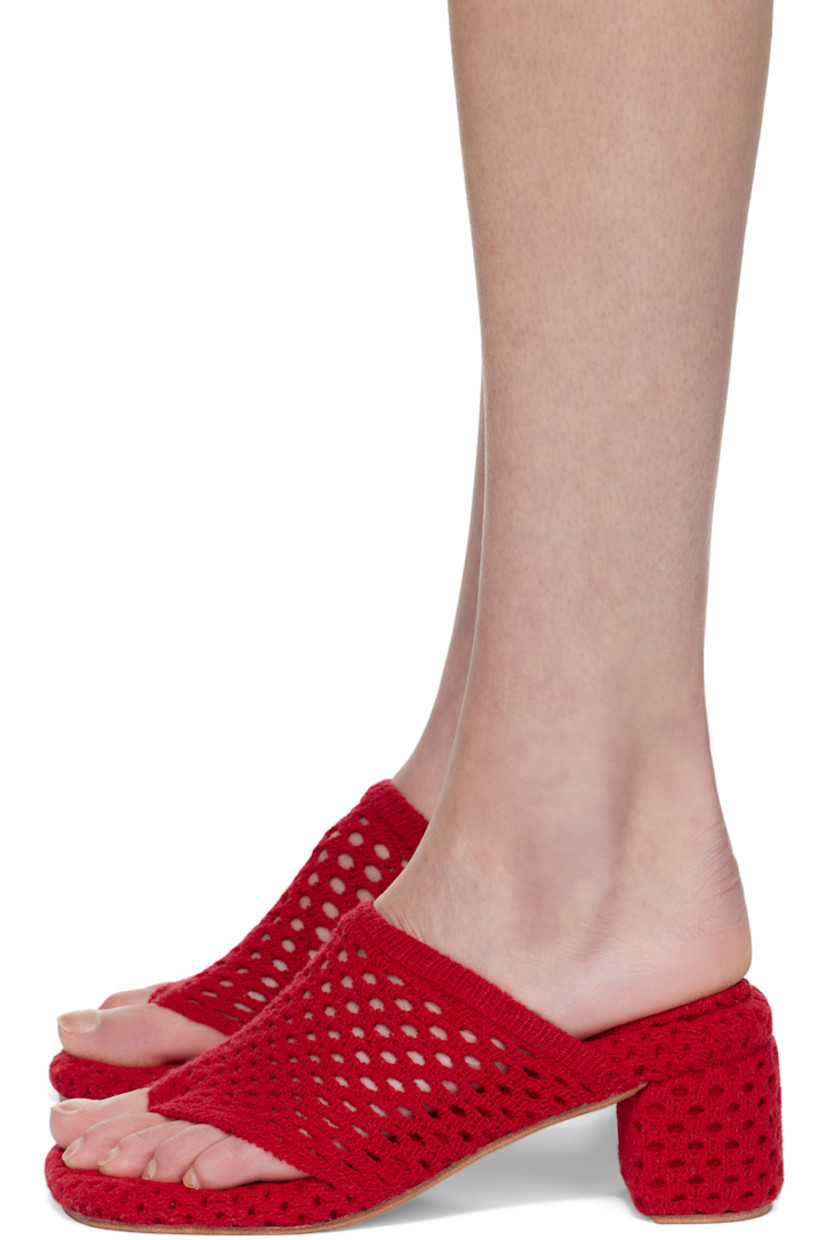 Open-knit heeled sandals in red. 

· Open square toe 
· Elasticized thong-style strap at vamp
· Logo patch at footbed
· Covered block heel 
· Leather sole 
· Heel: H2.75"

Wholesale exclusivity at SSENSE.

Supplier color: Cherry red