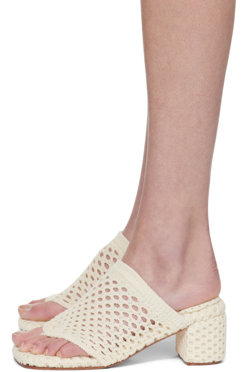 Open-knit heeled sandals in beige. 

· Elasticized thong-style strap at vamp
· Logo patch at footbed
· Covered block heel 
· Leather sole 
· Heel: H2.75"

Supplier color: Milk
