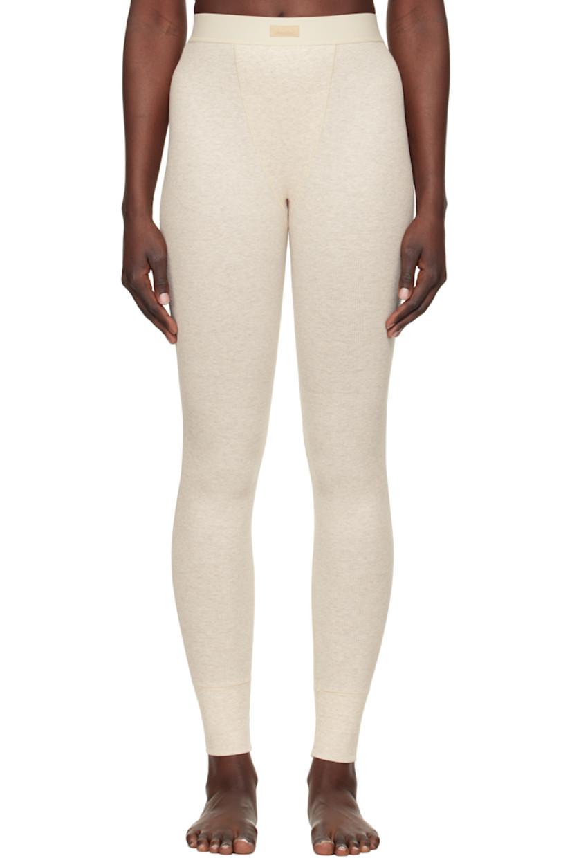 Stretch cotton ribbed jersey leggings. Lightweight and breathable.

· High-rise
· Logo patch at elasticized waistband
· Topstitching at front and back
· Partial jersey lining

Supplier color: Heather oatmeal