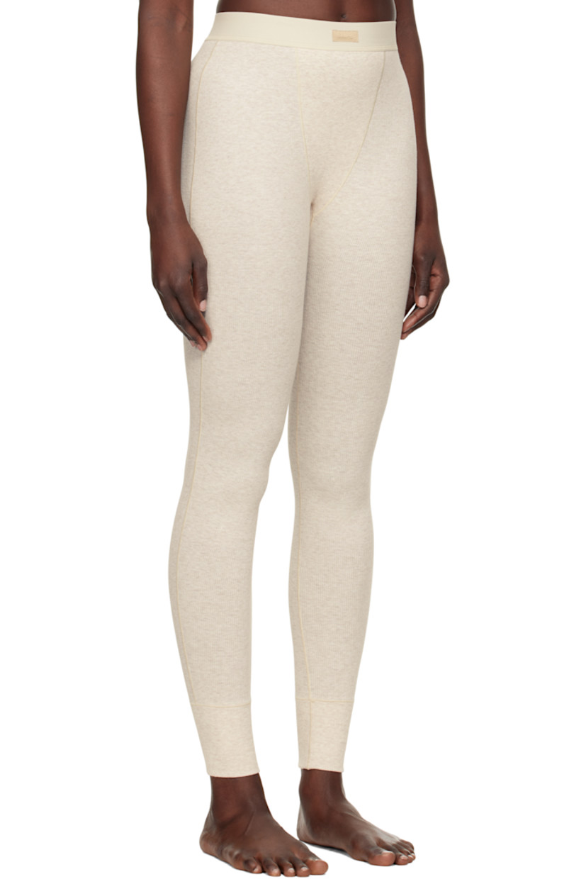 Stretch cotton ribbed jersey leggings. Lightweight and breathable.

· High-rise
· Logo patch at elasticized waistband
· Topstitching at front and back
· Partial jersey lining

Supplier color: Heather oatmeal