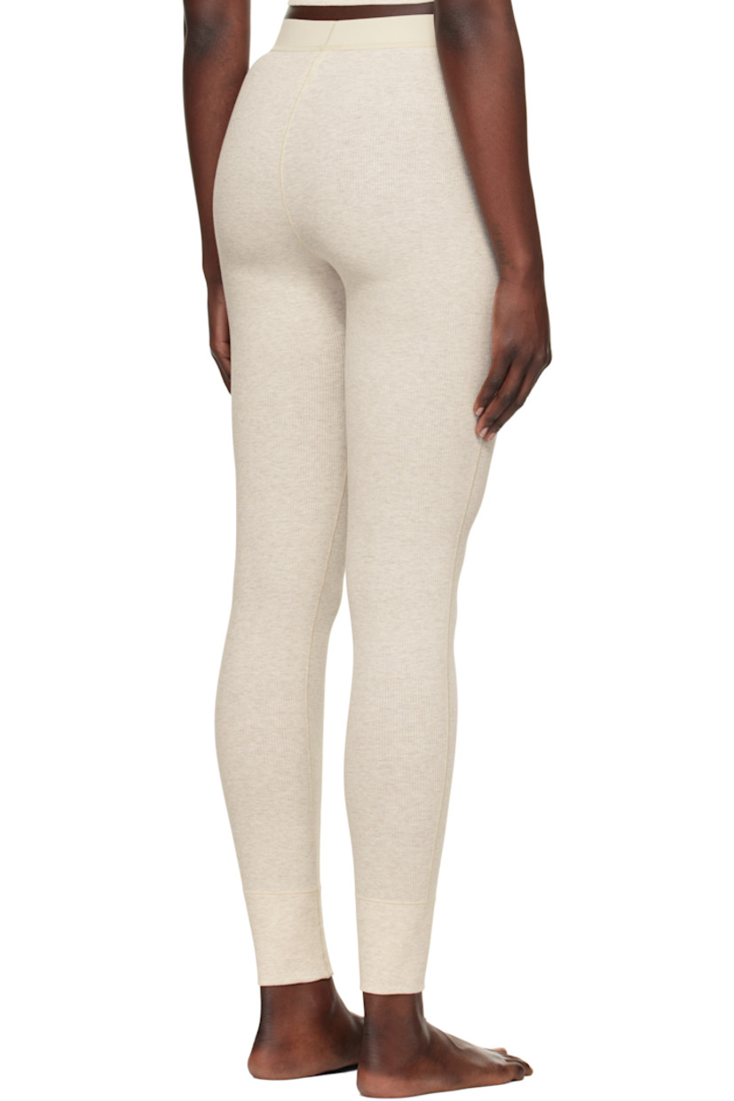 Stretch cotton ribbed jersey leggings. Lightweight and breathable.

· High-rise
· Logo patch at elasticized waistband
· Topstitching at front and back
· Partial jersey lining

Supplier color: Heather oatmeal