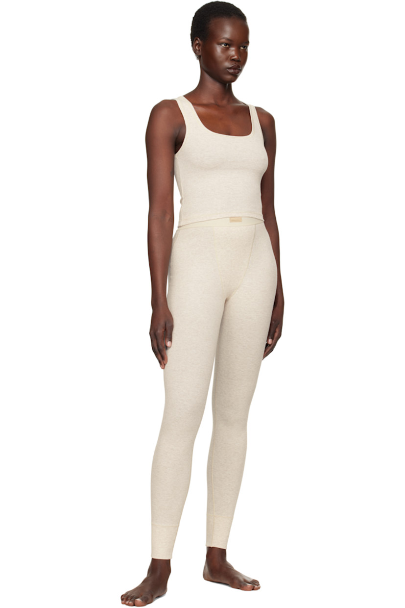 Stretch cotton ribbed jersey leggings. Lightweight and breathable.

· High-rise
· Logo patch at elasticized waistband
· Topstitching at front and back
· Partial jersey lining

Supplier color: Heather oatmeal
