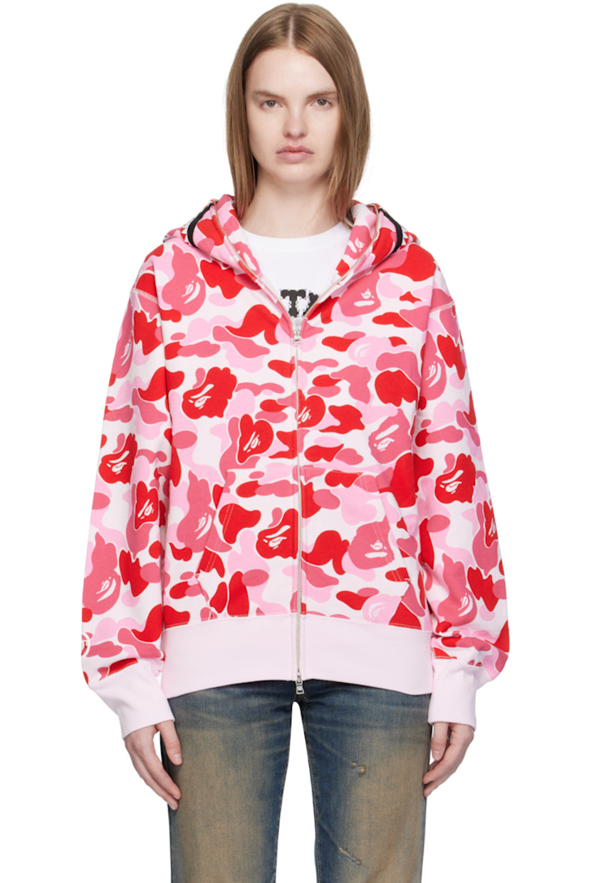 Cotton fleece hoodie.

· Logo camouflage pattern printed throughout
· Printed graphic and graphic appliqués at hood
· Two-way zip closure extends to hood
· Patch pockets at front
· Rib-knit hem and cuffs
· Logo flag at cuff

Supplier color: Pink