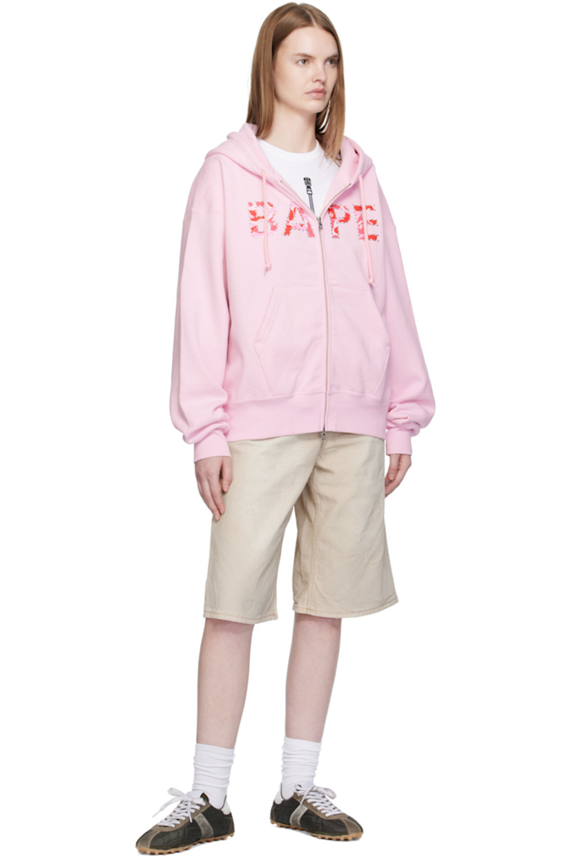 Cotton fleece hoodie. 

· Drawstring at hood
· Two-way zip closure
· Printed logo with crystal-cut detailing at chest
· Patch pockets at front
· Rib-knit hem and cuffs
· Dropped shoulders
· Logo flag at cuff

Supplier color: Pink