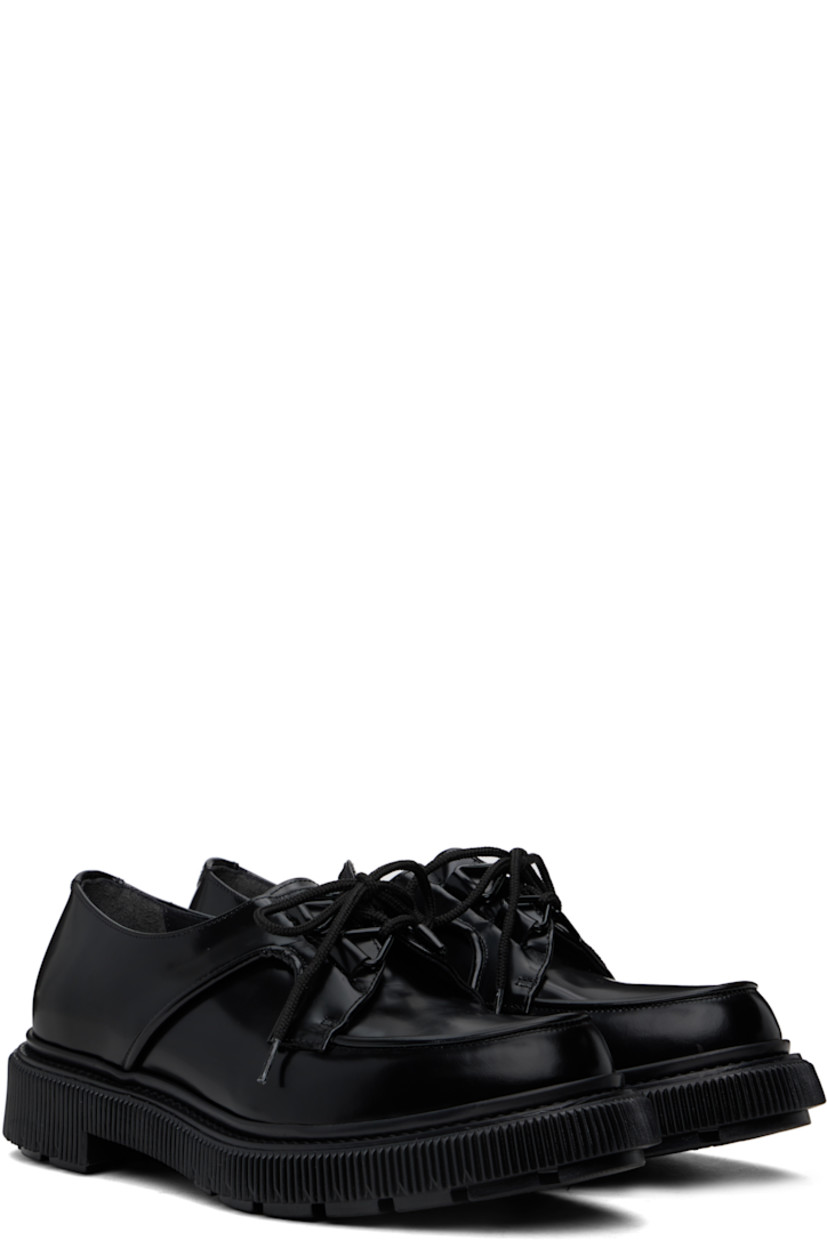 Polished leather derbys in black. 

· Moc toe
· Lace-up closure
· Logo printed at padded leather footbed
· Suede and buffed leather lining
· Topstitching at welt
· Textured rubber midsole
· Treaded rubber sole

Supplier color: Black