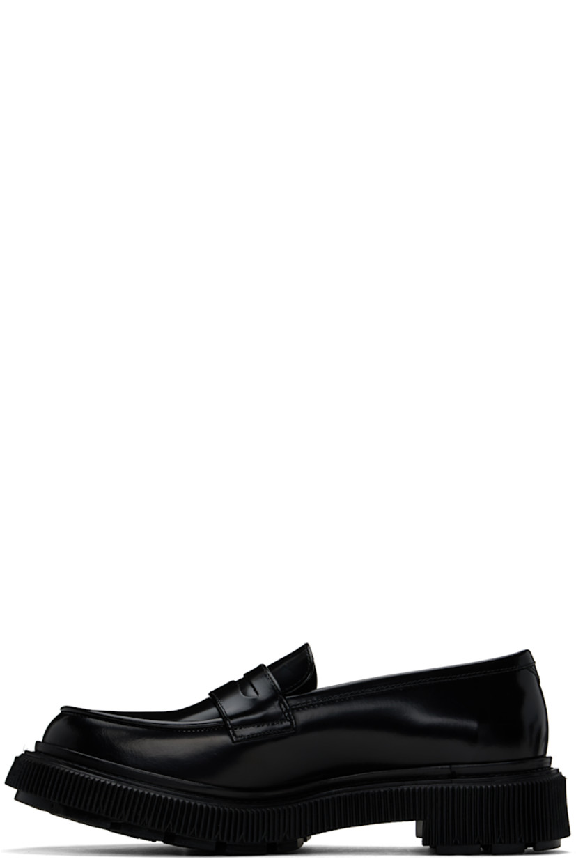 Polished leather loafers in black. 

· Moc toe
· Strap with cutout at vamp
· Logo printed at padded leather footbed
· Buffed leather and suede lining
· Topstitching at welt
· Textured rubber midsole
· Treaded rubber sole

Supplier color: Black