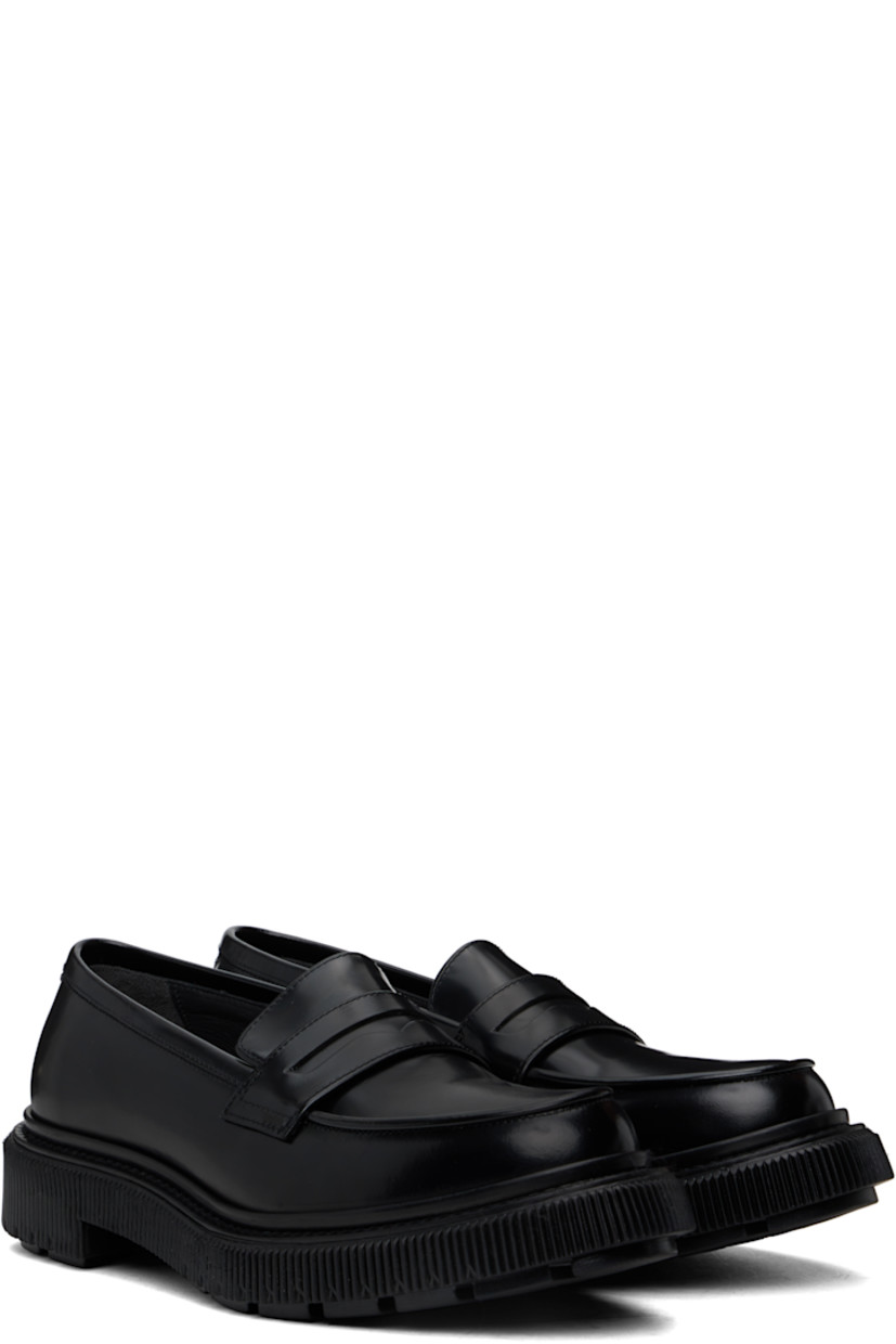 Polished leather loafers in black. 

· Moc toe
· Strap with cutout at vamp
· Logo printed at padded leather footbed
· Buffed leather and suede lining
· Topstitching at welt
· Textured rubber midsole
· Treaded rubber sole

Supplier color: Black
