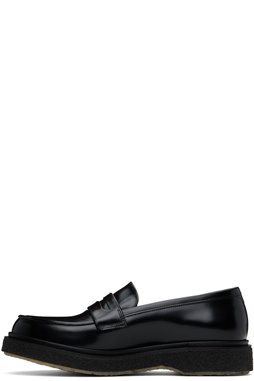 Polished leather loafers in black.

· Moc toe
· Strap with cutout at vamp
· Logo printed at padded leather footbed
· Suede and buffed leather lining
· Crepe rubber sole

Supplier color: Black