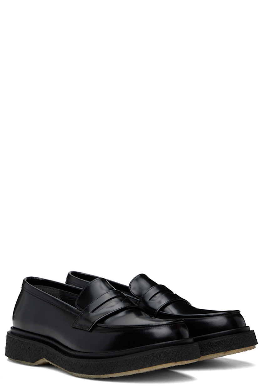 Polished leather loafers in black.

· Moc toe
· Strap with cutout at vamp
· Logo printed at padded leather footbed
· Suede and buffed leather lining
· Crepe rubber sole

Supplier color: Black
