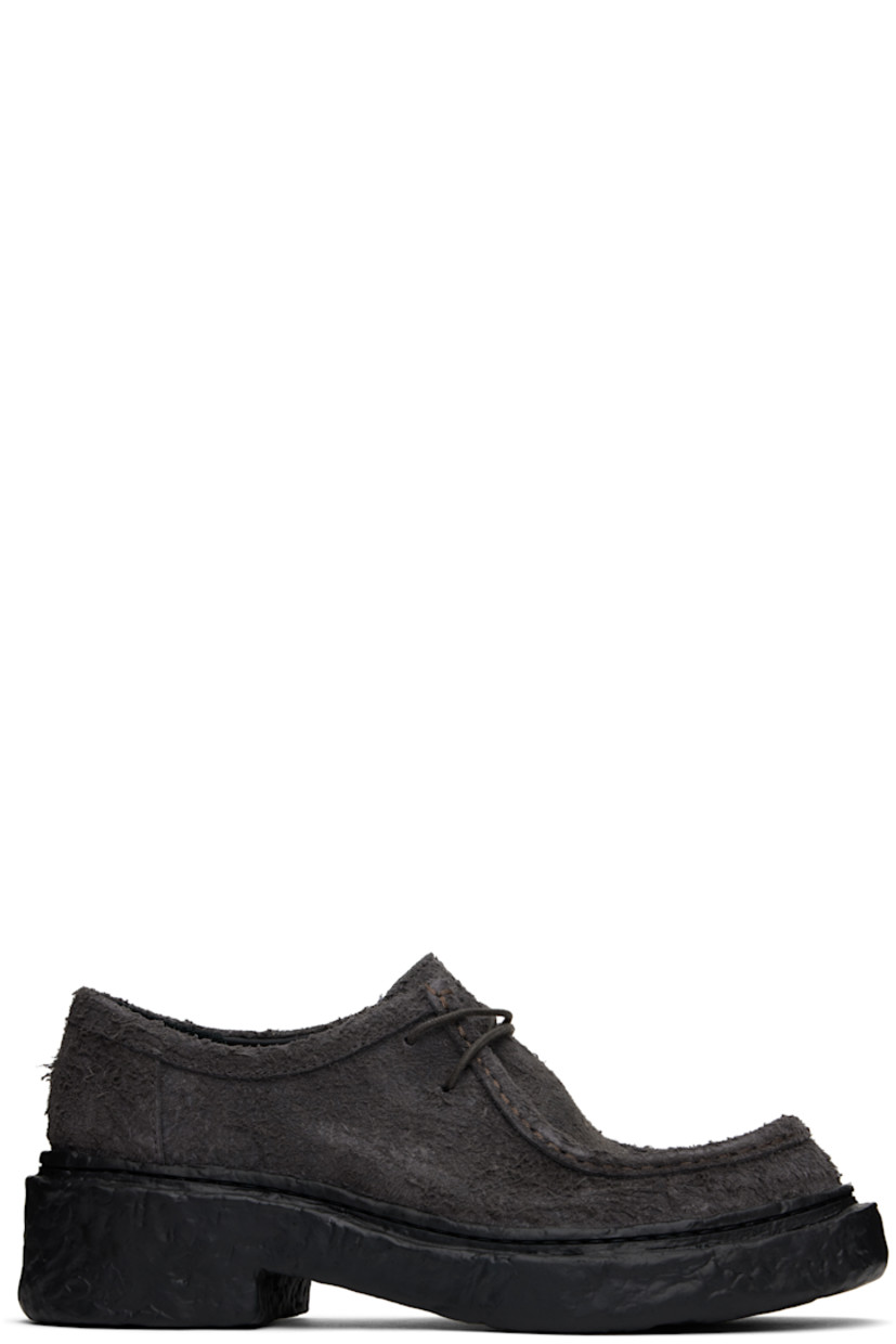 Nubuck derbys in gray. 

· Moc toe
· Lace-up closure
· OrthoLite® Recycled™ footbed
· Buffed leather and suede lining
· Textured midsole and heel
· Textured rubber sole
· Heel: H2"

Supplier color: Gray