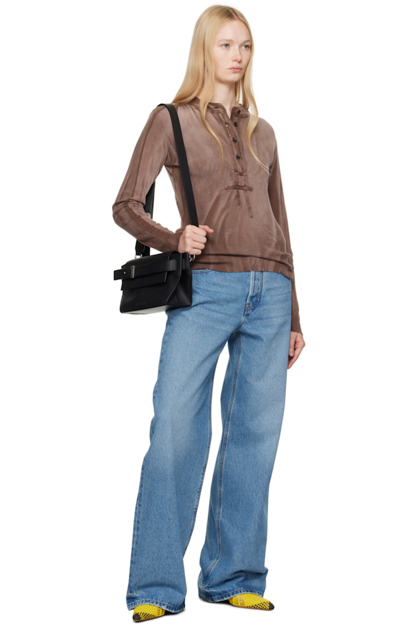 Washed non-stretch denim jeans. Whiskering and subtle distressing throughout. 

· Wide-leg 
· Mid-rise 
· Belt loops
· Logo locker loop at front waistband 
· Five-pocket styling
· Button fly 
· Leather logo patch at back waistband 
· Logo-engraved gold-tone hardware
· Contrast stitching in tan 

Part of the La Croisière collection.

Supplier color: Blue/Tabac
