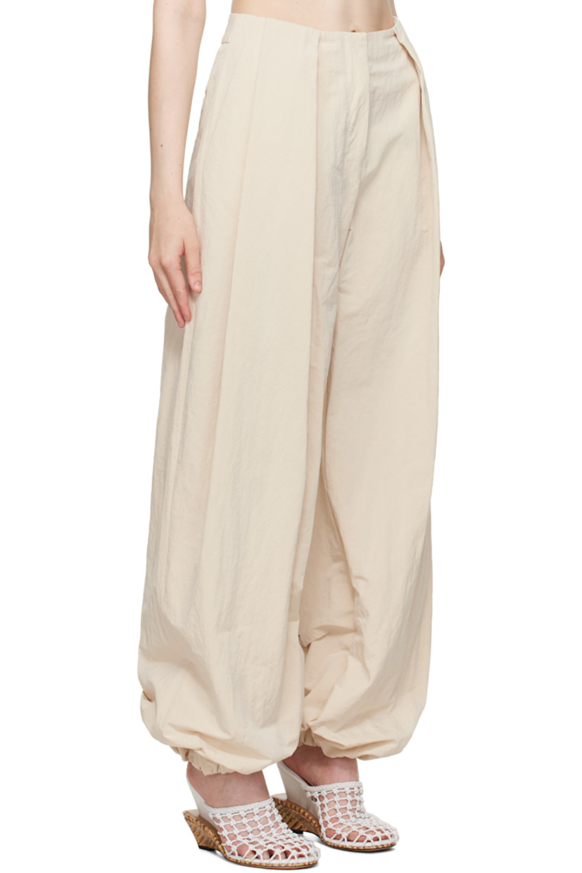 Wide-leg crinkled nylon-blend taffeta trousers. 

· Mid-rise 
· Belt loops
· Four-pocket styling 
· Zip fly
· Draped pleats at front 
· Press-stud fastening at gathered cuffs
· Notch at back waistband 
· Logo locker loop at back waist 
 
Part of the La Croisière collection.

Supplier color: Off-white