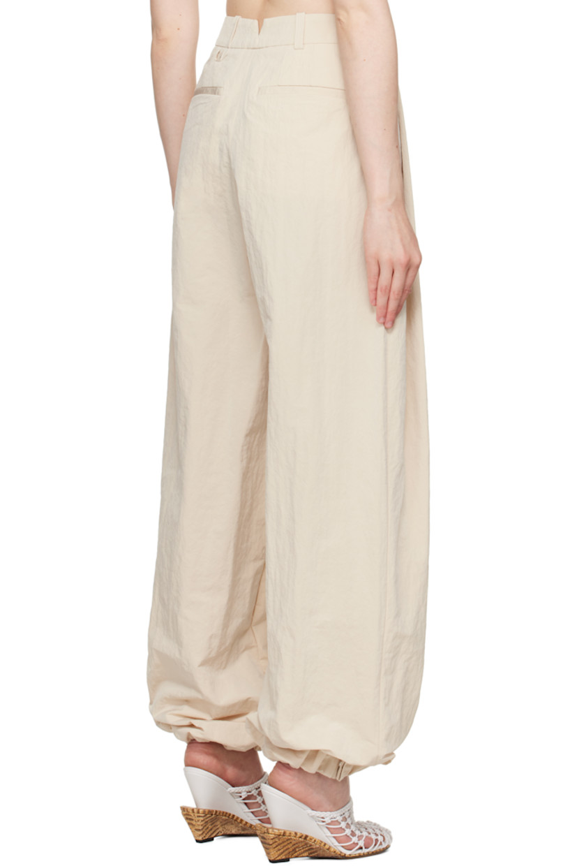 Wide-leg crinkled nylon-blend taffeta trousers. 

· Mid-rise 
· Belt loops
· Four-pocket styling 
· Zip fly
· Draped pleats at front 
· Press-stud fastening at gathered cuffs
· Notch at back waistband 
· Logo locker loop at back waist 
 
Part of the La Croisière collection.

Supplier color: Off-white