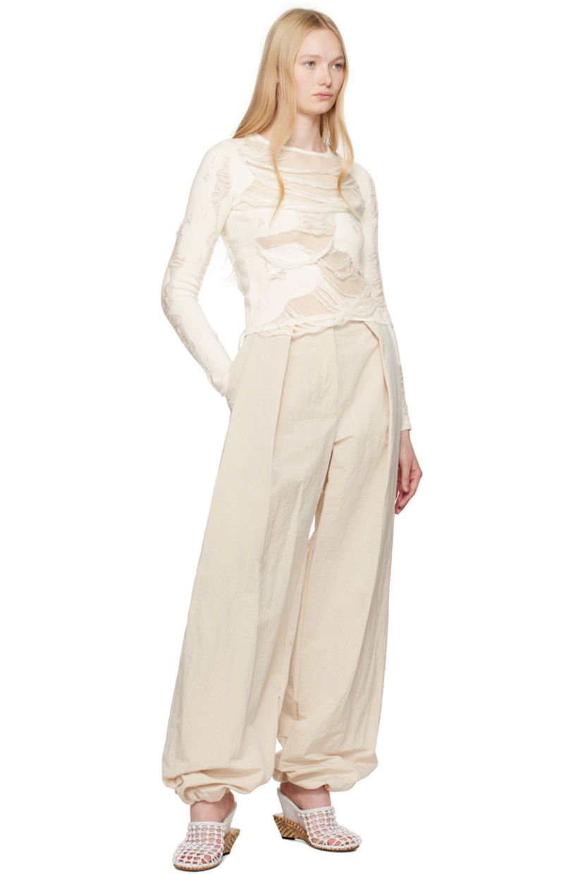 Wide-leg crinkled nylon-blend taffeta trousers. 

· Mid-rise 
· Belt loops
· Four-pocket styling 
· Zip fly
· Draped pleats at front 
· Press-stud fastening at gathered cuffs
· Notch at back waistband 
· Logo locker loop at back waist 
 
Part of the La Croisière collection.

Supplier color: Off-white