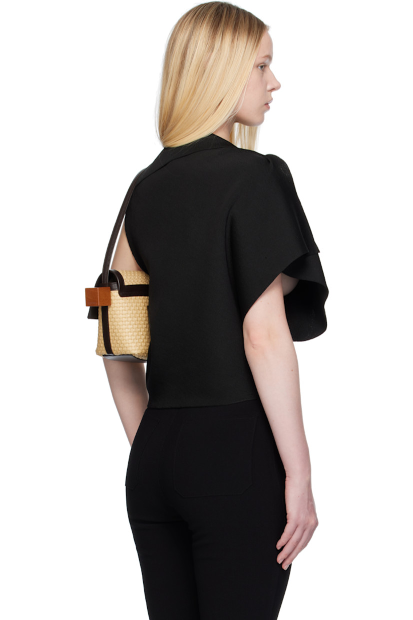 Milano-stitch knit viscose-blend top.

· Asymmetrical construction
· Foldover neck
· Integrated brooch at shoulder
· Silver-tone hardware

Part of the La Croisière collection.

Supplier color: Black