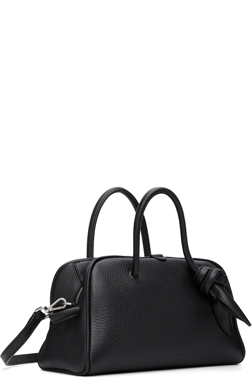 Pebble-grained calfskin tote.

· Fixed rolled carry handles
· Knotted detailing at handle
· Adjustable and detachable shoulder strap
· Logo embossed at face
· Two-way zip closure
· Card slot at interior 
· Cotton twill lining
· Silver-tone hardware
· H6" x W10" x D4.5"

Part of the La Croisière collection.

Supplier color: Black