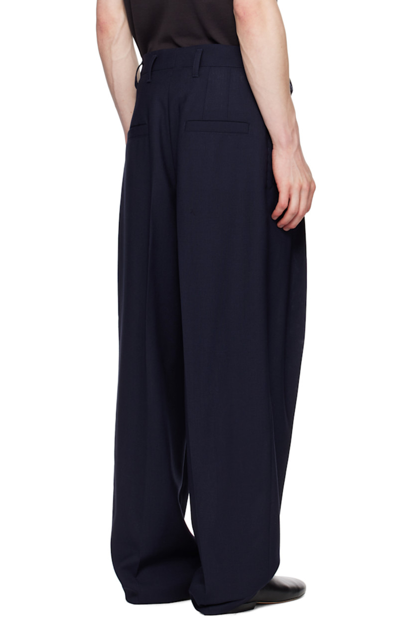 Wide-leg wool delaine trousers.

· Mid-to-high rise
· Belt loops and integrated cinch belt
· Five-pocket styling
· Zip fly
· Pleats at front

Part of the La Croisière collection.

Supplier color: Navy