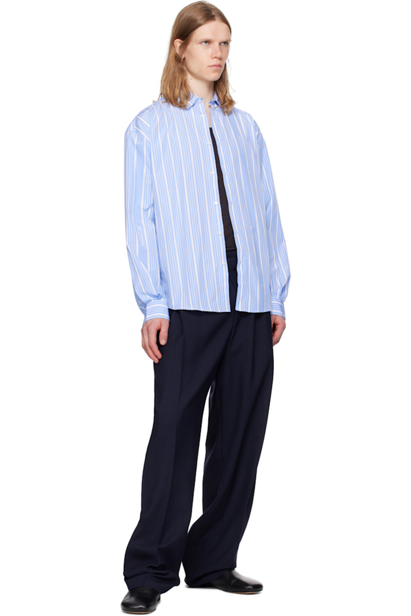 Wide-leg wool delaine trousers.

· Mid-to-high rise
· Belt loops and integrated cinch belt
· Five-pocket styling
· Zip fly
· Pleats at front

Part of the La Croisière collection.

Supplier color: Navy