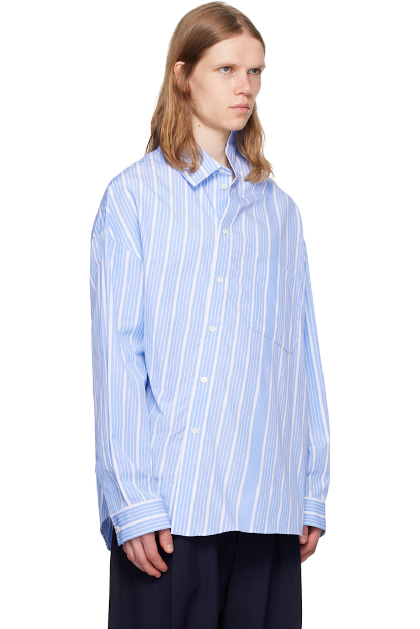 Cotton poplin shirt. Stripes and jacquard logos throughout.

· Asymmetric construction
· Spread collar
· Offset button closure
· Patch pocket at chest
· Shirttail hem
· Buttoned barrel cuffs
· Locker loop at back collar
· Mother-of-pearl hardware

Part of the La Croisière collection.

Supplier color: Jacquard blue/White