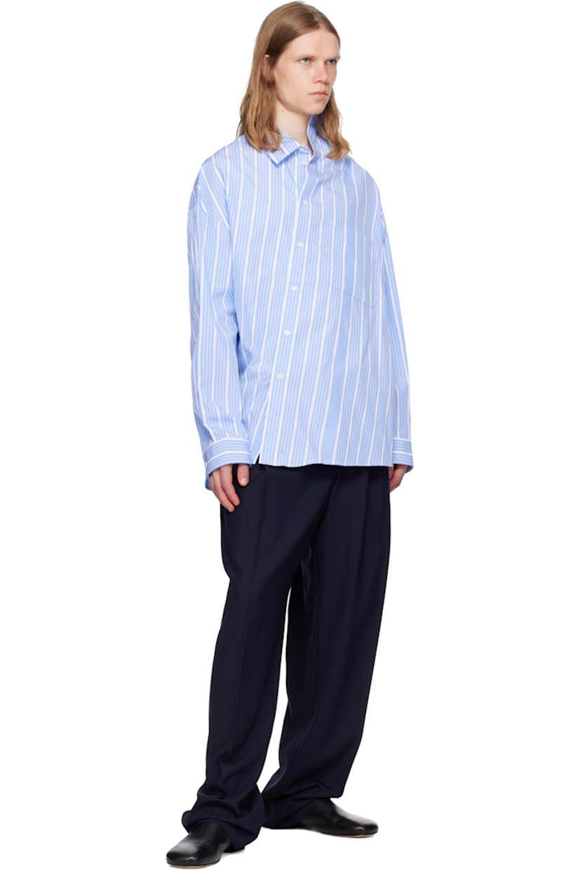 Cotton poplin shirt. Stripes and jacquard logos throughout.

· Asymmetric construction
· Spread collar
· Offset button closure
· Patch pocket at chest
· Shirttail hem
· Buttoned barrel cuffs
· Locker loop at back collar
· Mother-of-pearl hardware

Part of the La Croisière collection.

Supplier color: Jacquard blue/White
