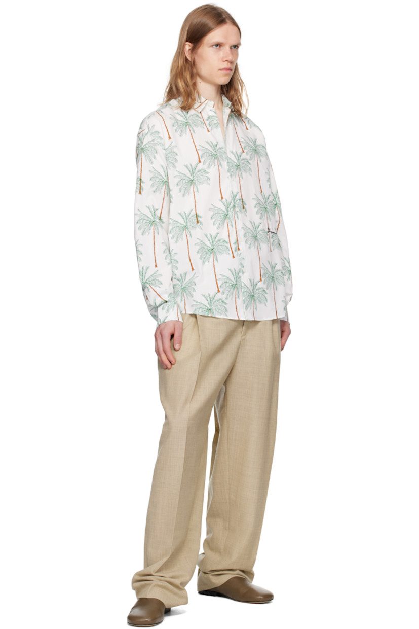 Cotton poplin shirt. Graphic pattern printed throughout.

· Spread collar
· Button closure
· Shirttail hem
· Buttoned barred cuffs
· Locker loop at back collar
· Pleats at back yoke
· Mother-of-pearl hardware

Part of the La Croisière collection.

Supplier color: Print palmtrees drawing white