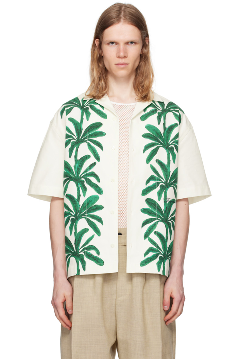 Cotton canvas shirt. 

· Open spread collar
· Button closure
· Graphic pattern printed at front
· Locker loop at back collar
· Mother-of-pearl hardware

Part of the La Croisière collection.

Supplier color: Print painted palmtrees white/green