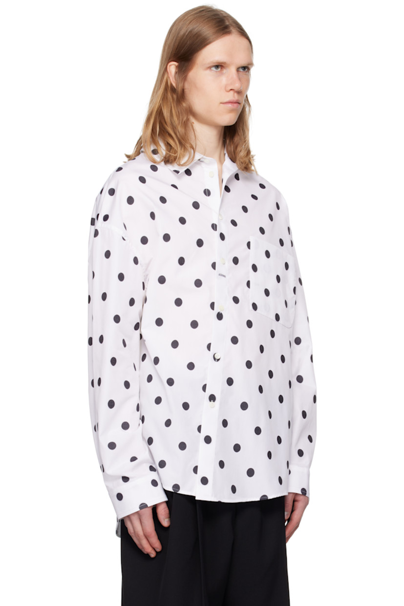 Cotton poplin shirt. Jacquard polka-dot pattern throughout.

· Asymmetric construction
· Spread collar
· Offset button closure
· Patch pocket at chest
· Shirttail hem
· Buttoned barrel cuffs
· Locker loop at back collar
· Mother-of-pearl hardware

Part of the La Croisière collection.

Supplier color: Jacquard dots