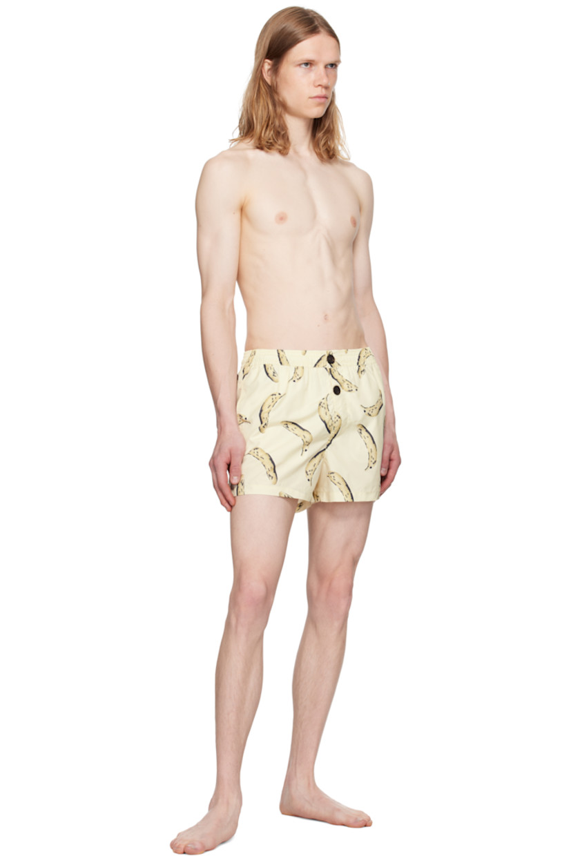 Polyester taffeta swim shorts. Graphic pattern printed throughout.

· Concealed drawstring at elasticized waistband
· Three-pocket styling
· Exposed button fly
· Logo patch at back pocket
· Briefs-style mesh lining

Part of the La Croisière collection.

Supplier color: Banana print yellow