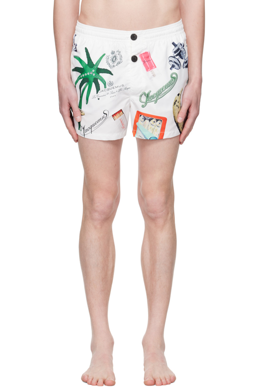 Polyester taffeta swim shorts. Logos and graphics printed throughout.

· Concealed drawstring at elasticized waistband
· Three-pocket styling
· Exposed button fly
· Embroidered logo patch at back pocket
· Brief-style mesh lining

Part of the La Croisière collection.

Supplier color: Off-white & printed patch
